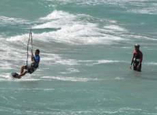 Kitesurf equipment prepared on a sandy beach
